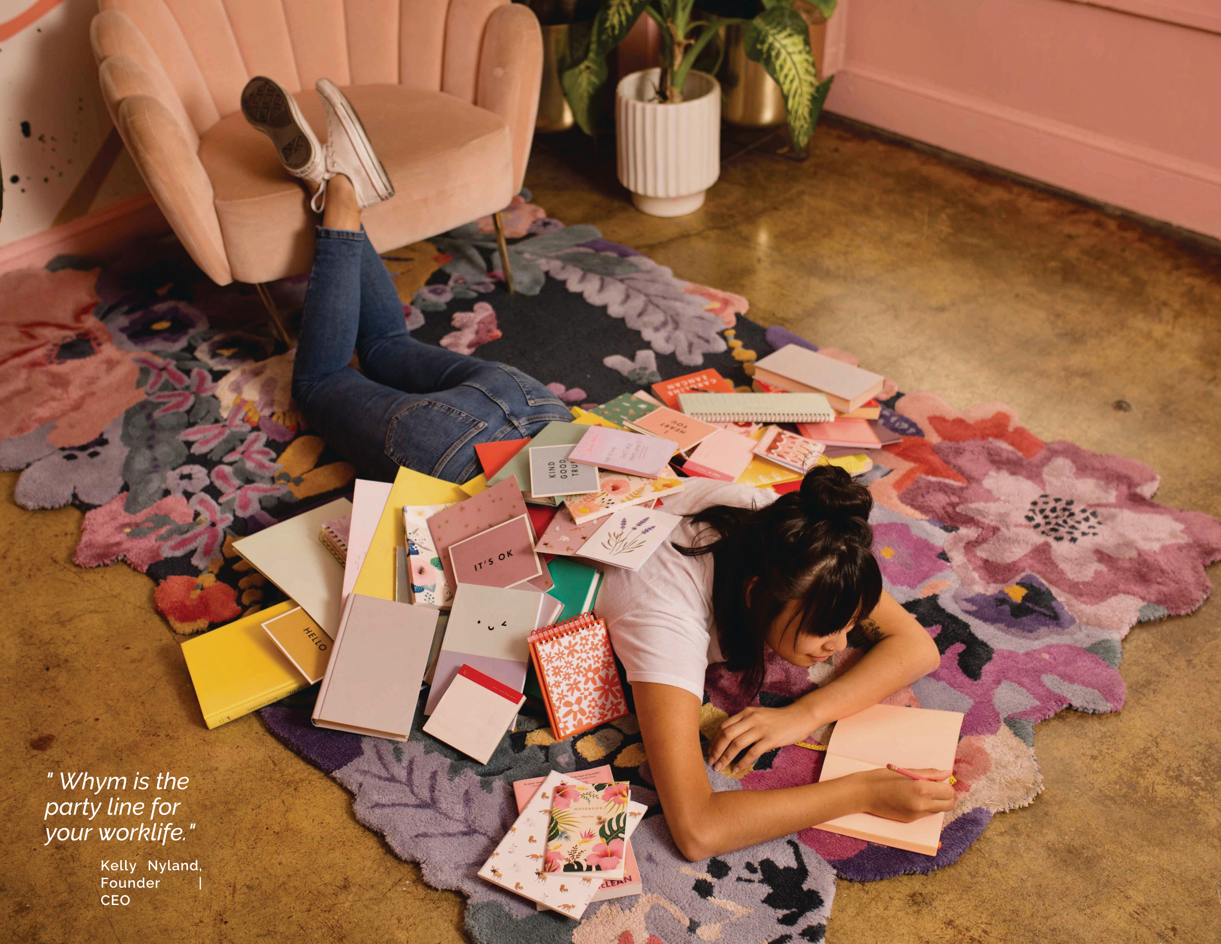Woman lying on a floral rug surrounded by stationery, with a pull quote from Kelly Nyland, Founder and CEO