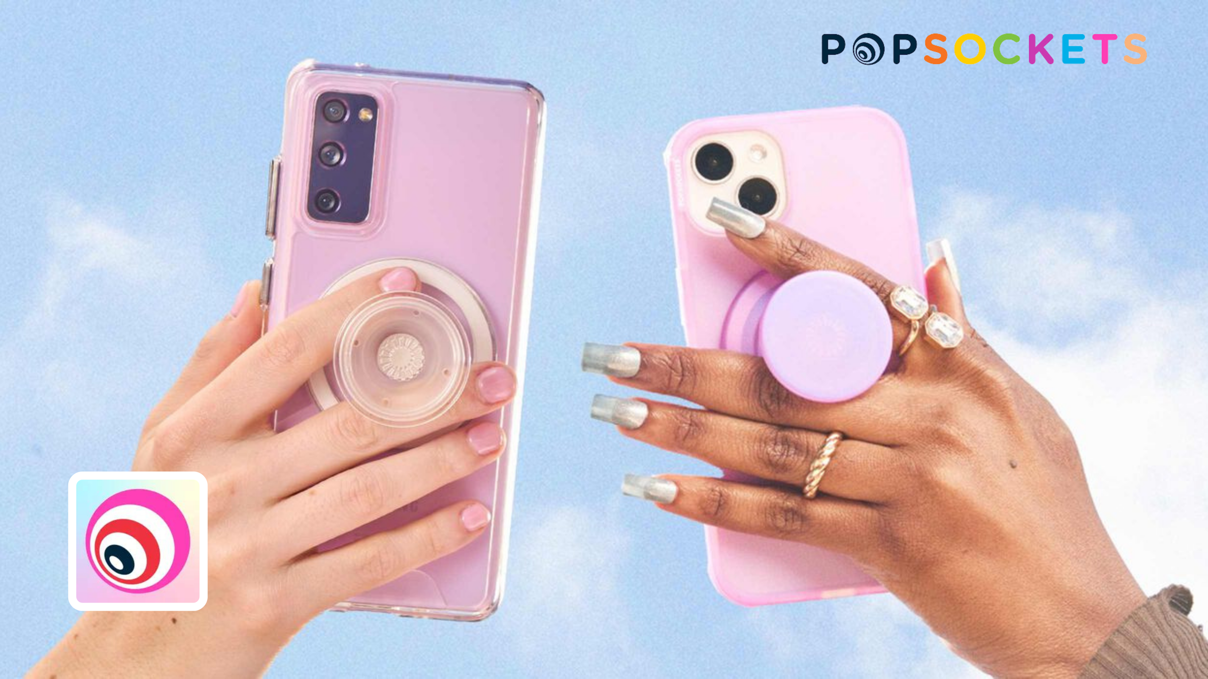 Two hands holding pink phone cases fitted with round PopSockets grips against a blue sky, PopSockets wordmark above