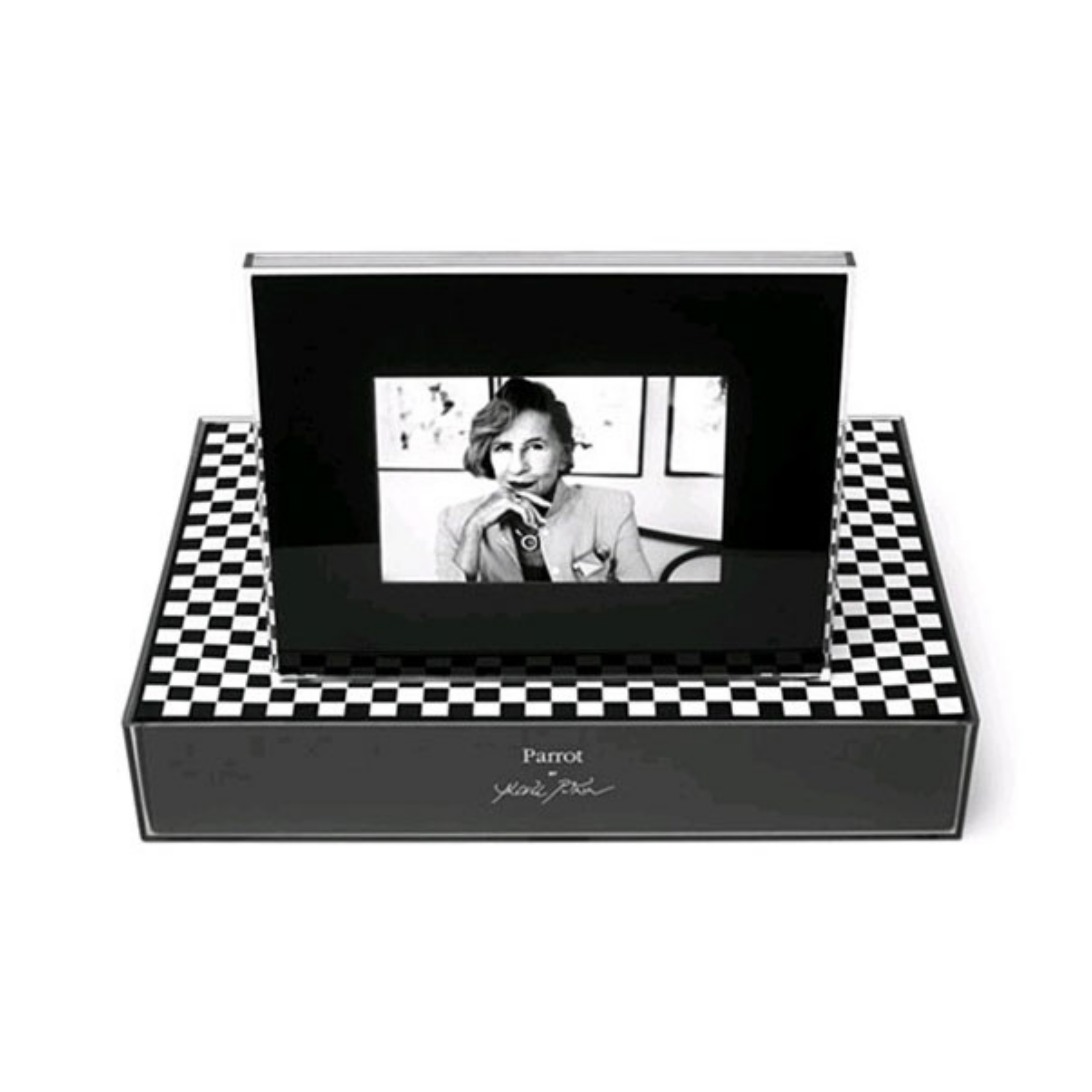 Black digital photo frame set in a checkerboard-topped base, displaying a black-and-white portrait of a person