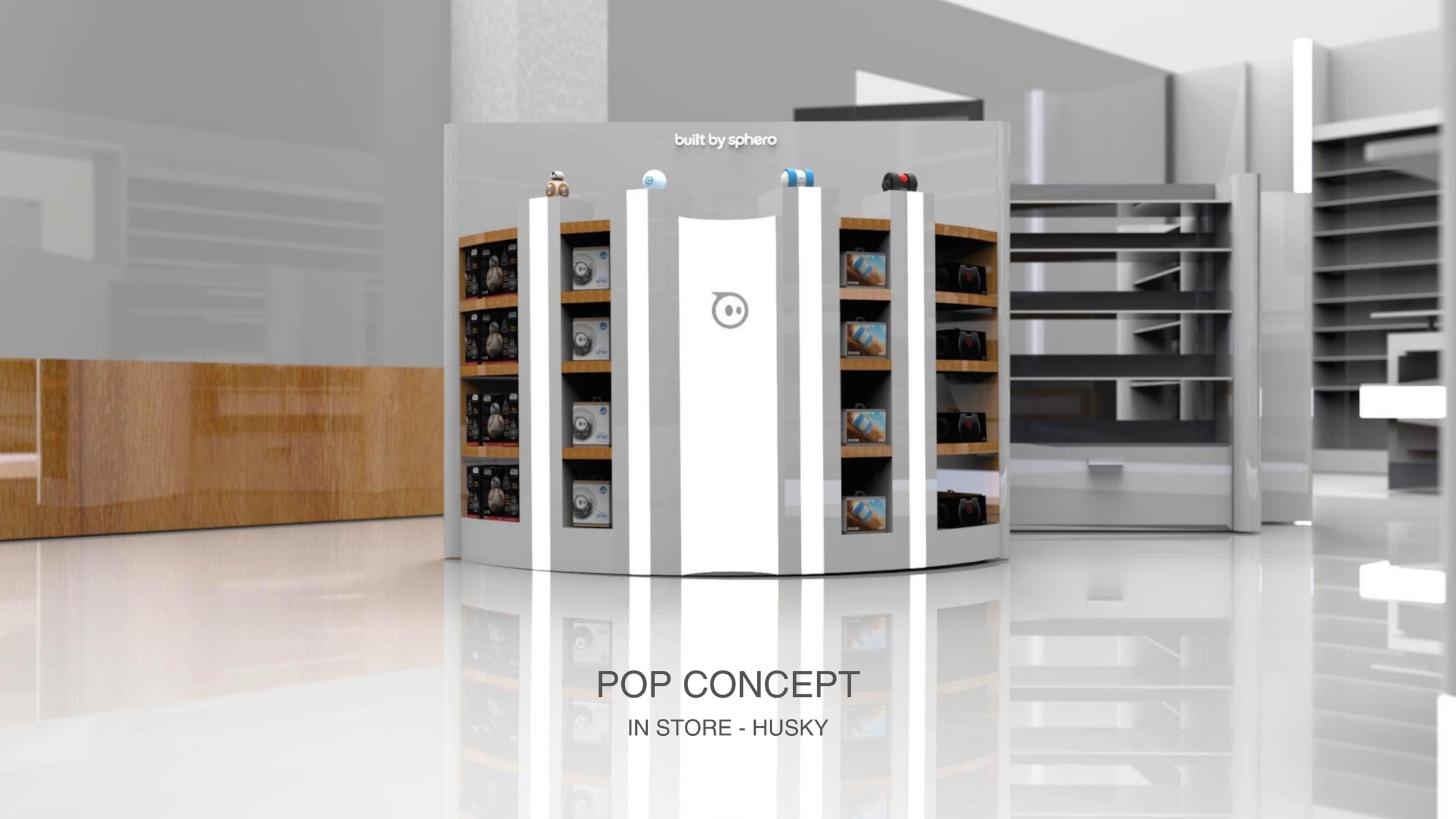 Curved white Sphero floor fixture in a store stocked with boxed BB-8, SPRK and Ollie, labeled POP CONCEPT IN STORE - HUSKY